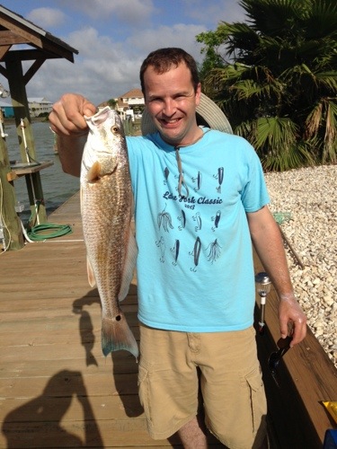 Chris holding a redfish