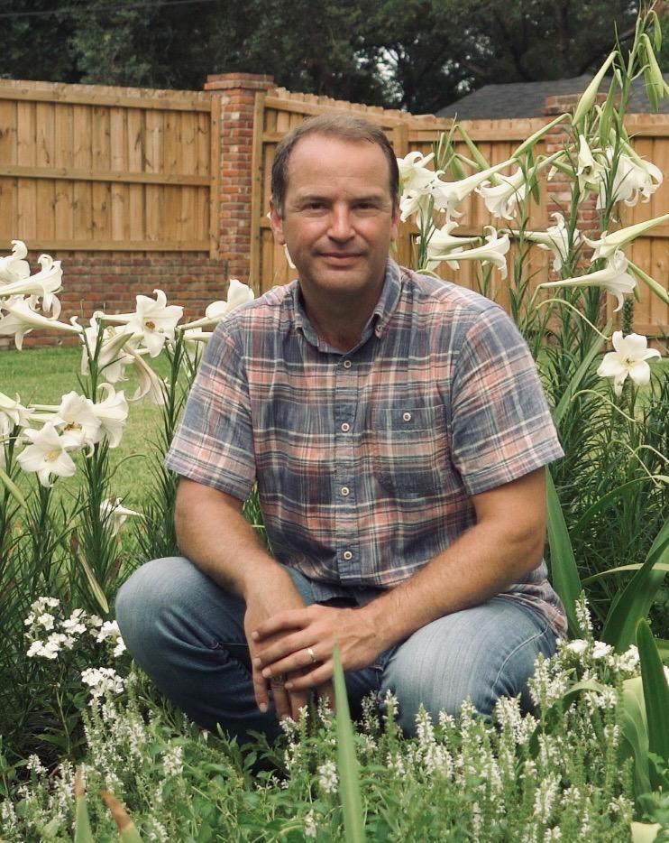 Chris Wiesinger, The Bulb Hunter, among Philippine lilies in the garden