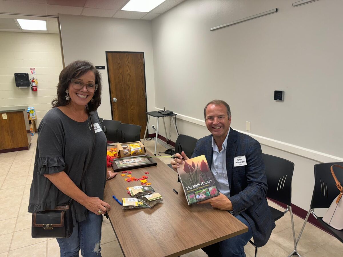 Chris signs copies of The Bulb Hunter after a talk