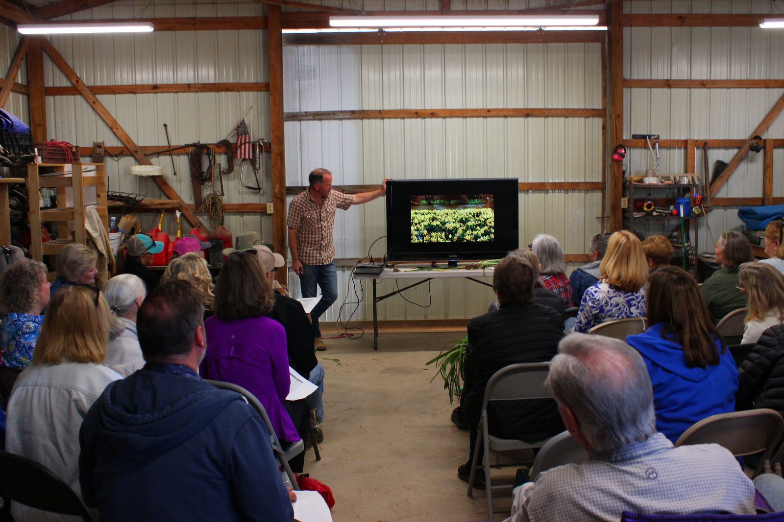 Chris Wiesinger walking the audience through slides of daffodil fields